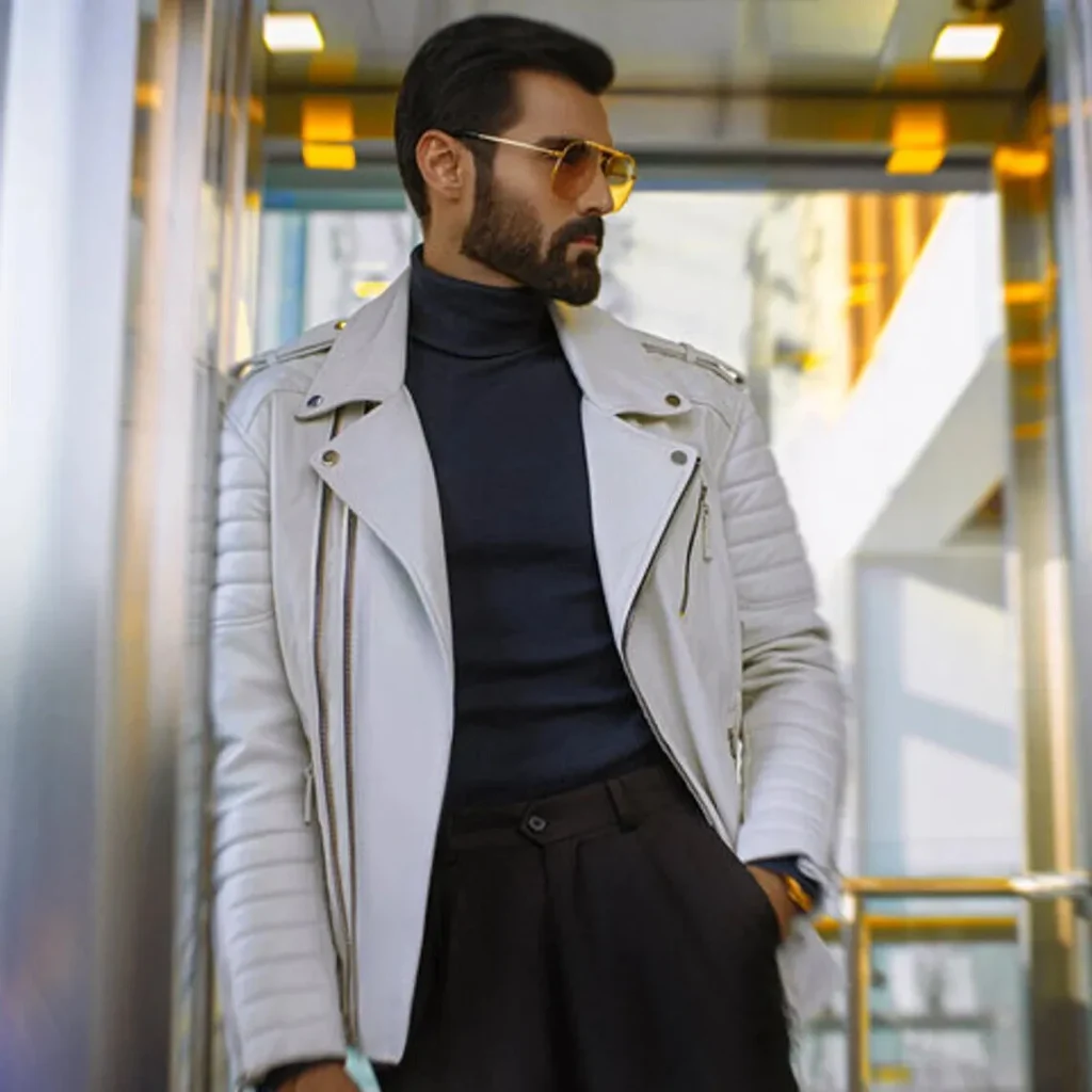 A man standing wearing a white color leather jacket